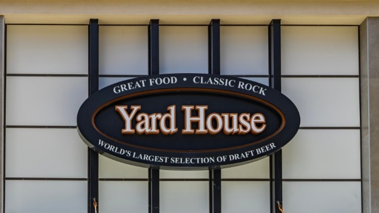 The exterior of a Yard House with the sign in focus.