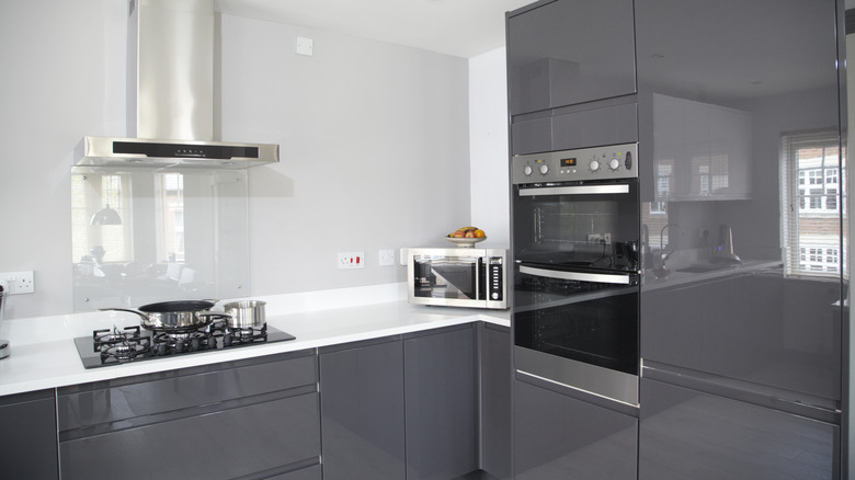 The Go-To Cabinet Color And Finish That's Now Tired, Basic, And Outdated