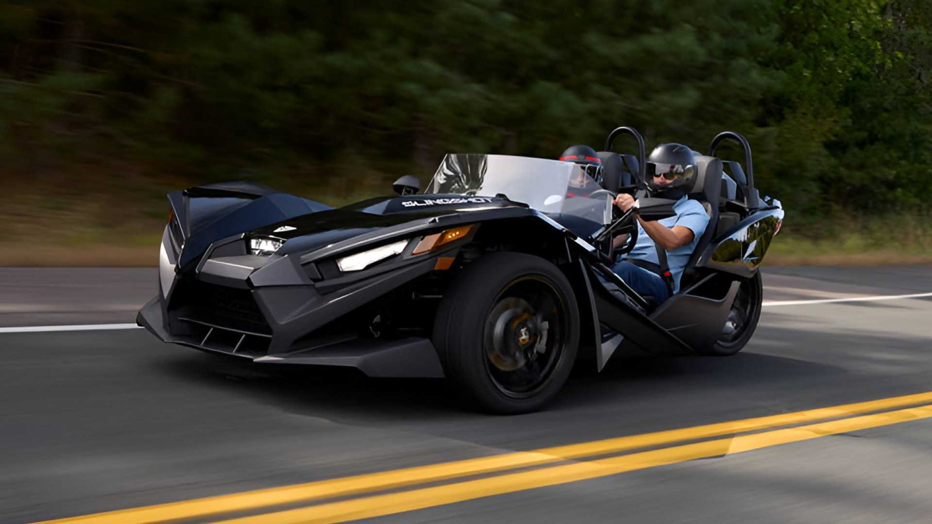 ​​​​​​​2026 Polaris Slingshot S accelerating on the road front third quarter view