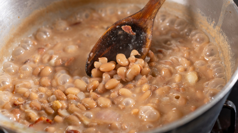 Beans cooking in pot on stove