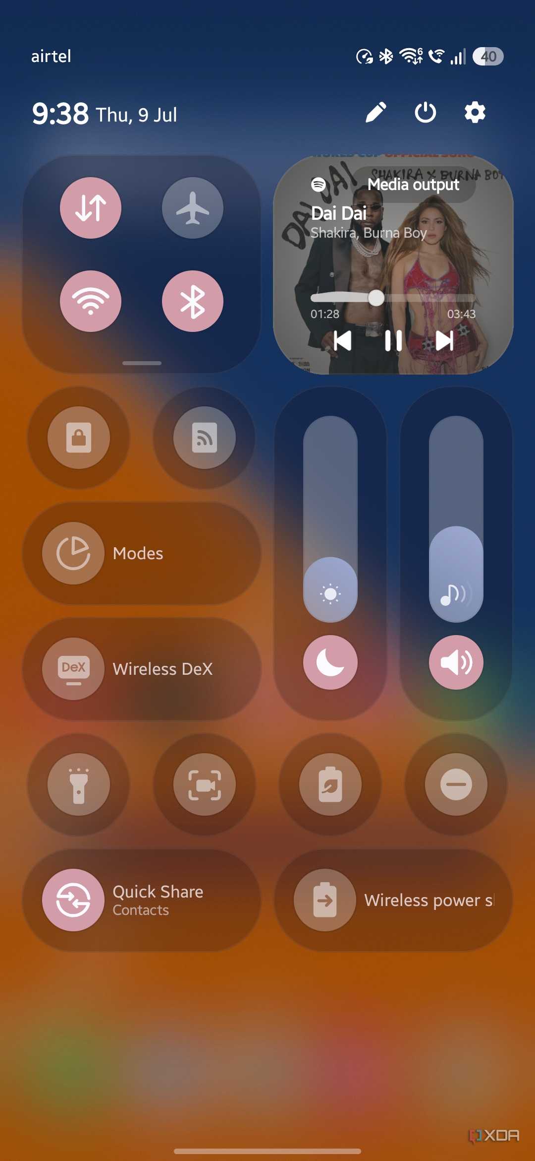 Default Quick Panel layout with brightness and volume sliders, Modes, Wireless DeX, and a media player card