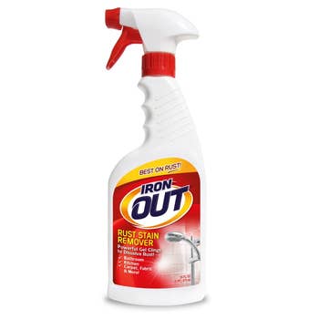 Iron Out Rust Stain Remover spray bottle, marketed for use on kitchenware, carpet, fabric, and more to dissolve rust