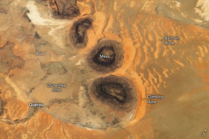 As the International Space Station orbited over the Sahara Desert in the late-afternoon of May 3, 2023, an astronaut took this photograph of hills and sand dunes in southern Mauritania. Credit: NASA/JSC Gateway to Astronaut Photography of Earth