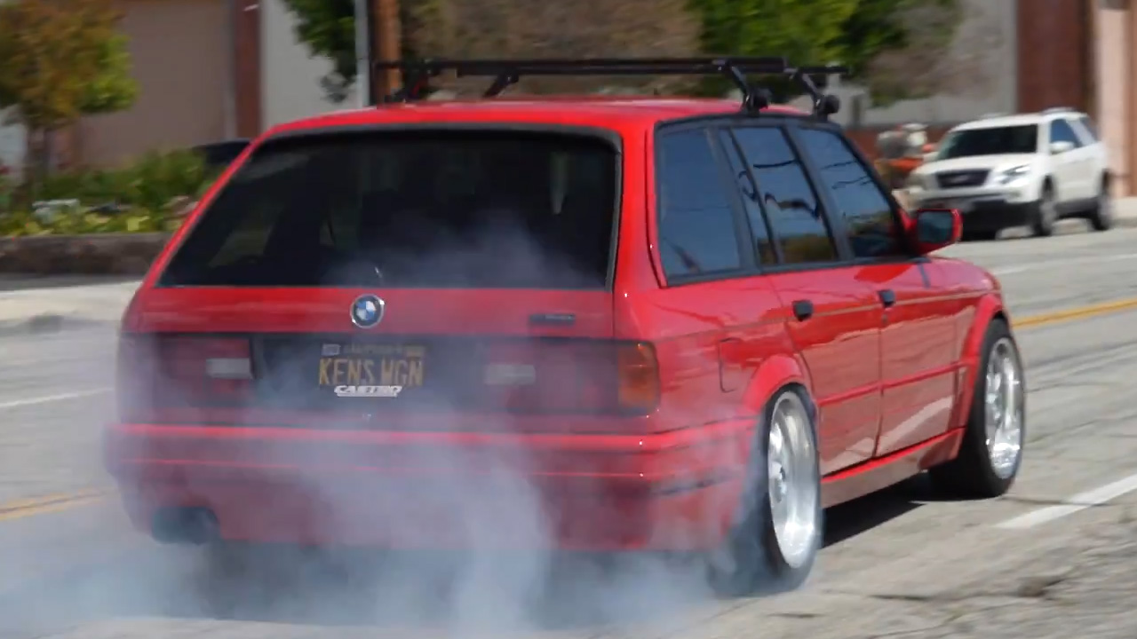 A sleeper BMW E30 touring wagon with a supercharger inside