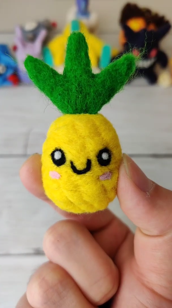Wool pineapple craft created with amazing needle felting skills