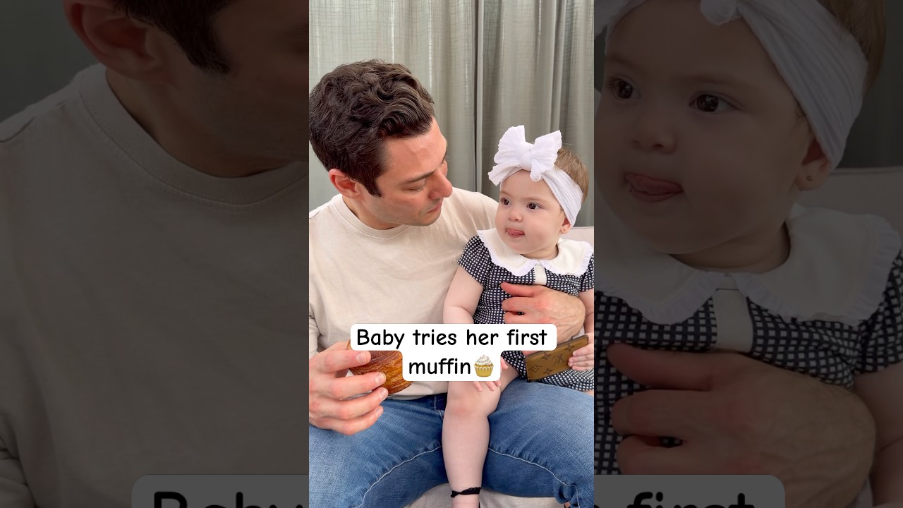 Adorable baby tastes her very first muffin and loves it