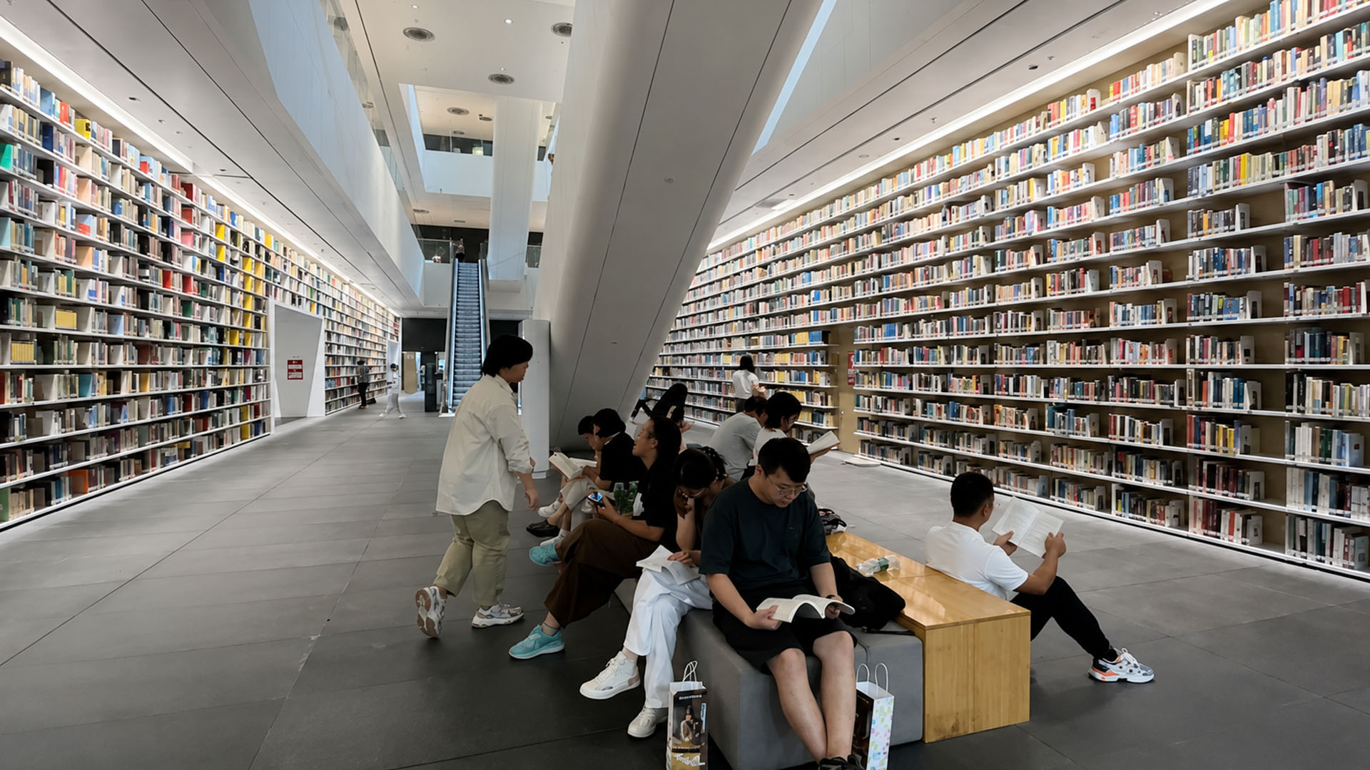 China's library features towering shelves filled with countless printed ...