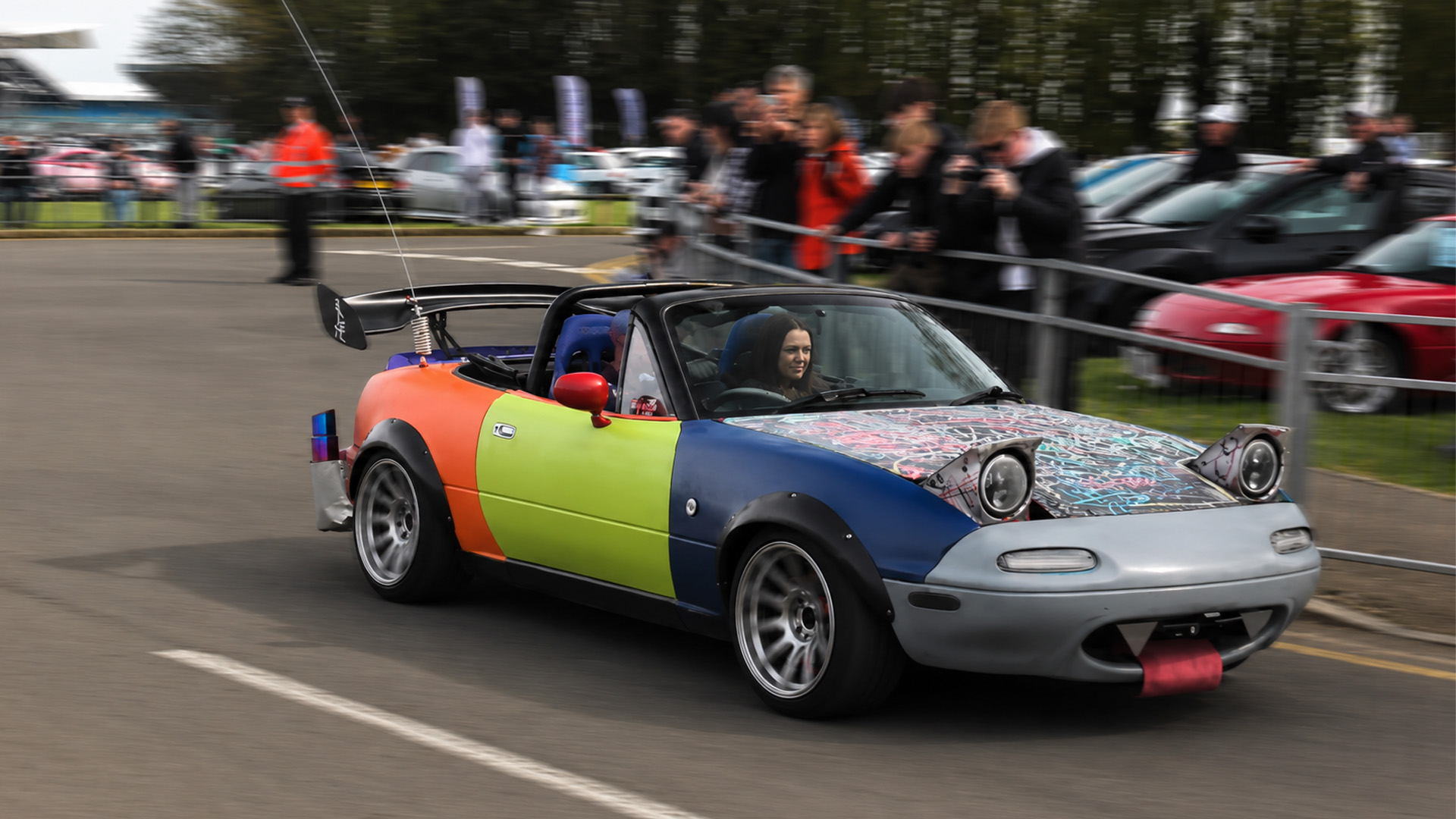 Modified Mazda Miata leaves crowd with hard acceleration