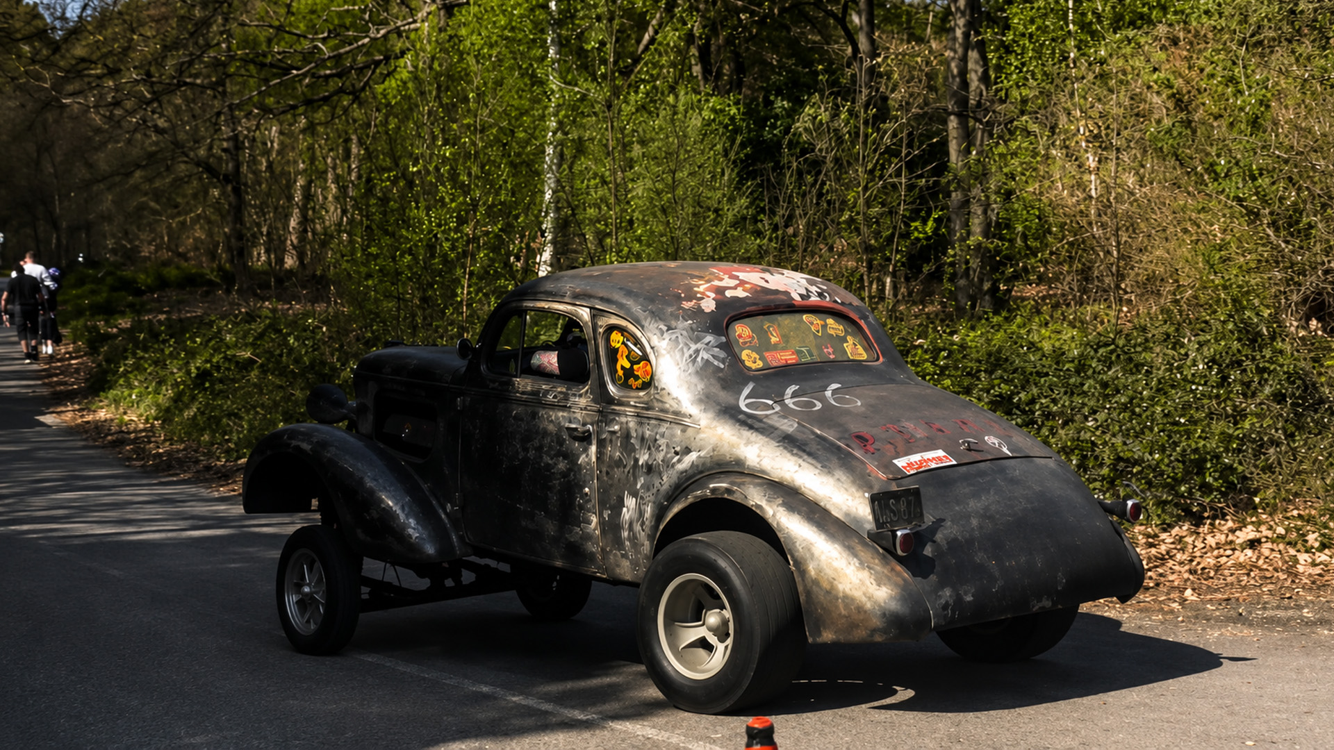Custom classic Chevrolet gasser leaves car show in style