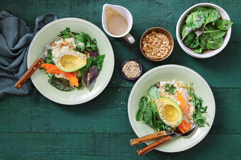 Avocado bowl with couscous, vegetables and tahini lemon dressing