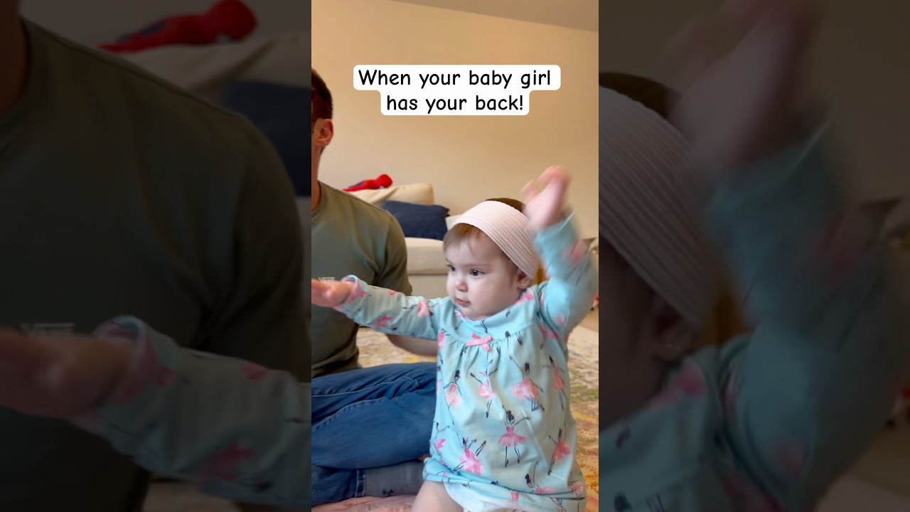 Dad shows how baby girl always has his back