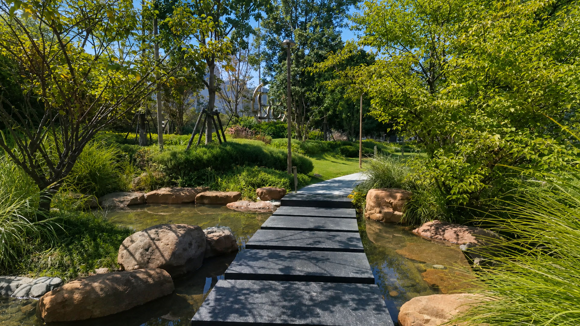 A futuristic city park features a natural stream and stone walkway