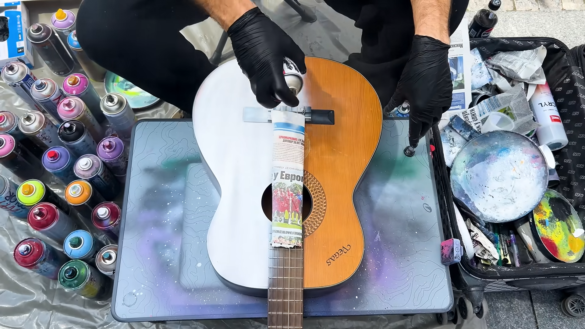 She let a street artist spray paint her guitar