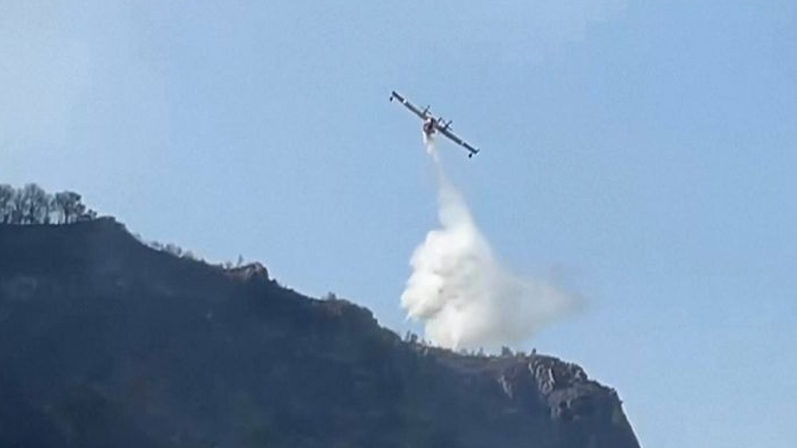 Water-dropping planes tackling Italy wildfires