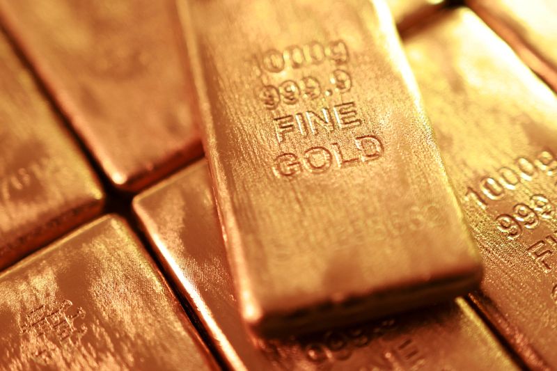 Gold falls on firm dollar, spotlight on Fed's rate decision