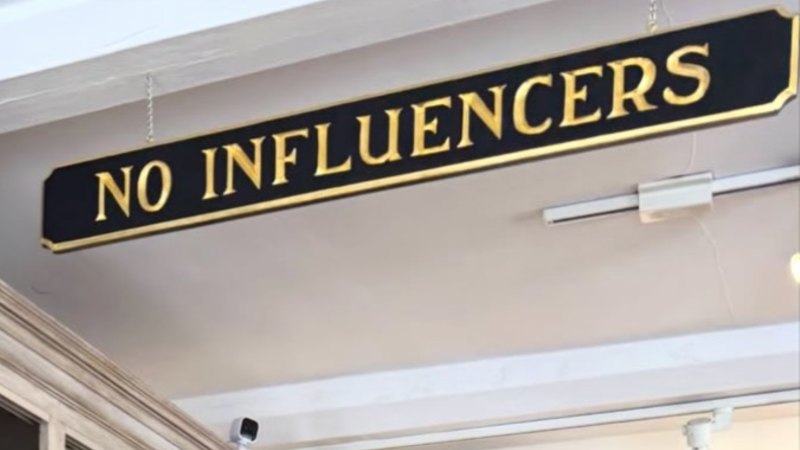 Two words on local store sign spark online feud with influencer Paige Lorenze