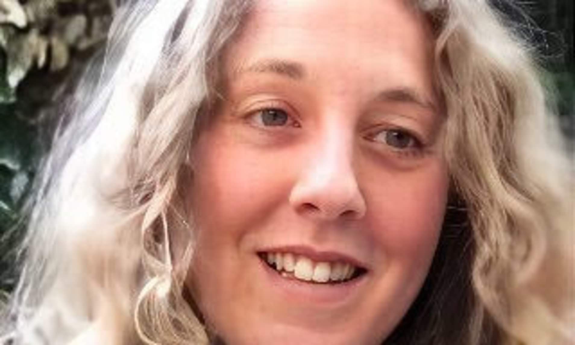 Woman, 47, was killed by 40-tonne truck while clambering out of car after crash, inquest hears