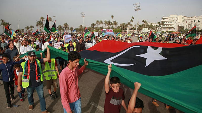 Libyans hold a demonstration in Martyrs' Square protesting military operations by forces loyal to Field Marshal Khalifa Haftar in Tripoli, Libya, Friday 3 May 2019.