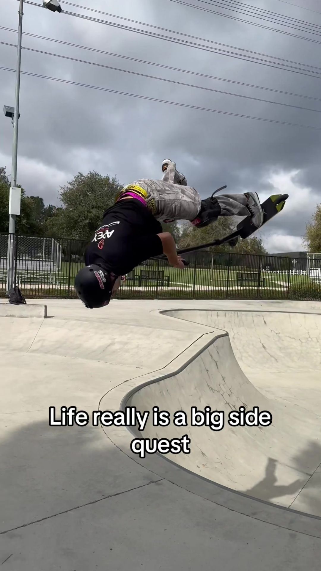 Scooter rider lands an impressive skatepark trick