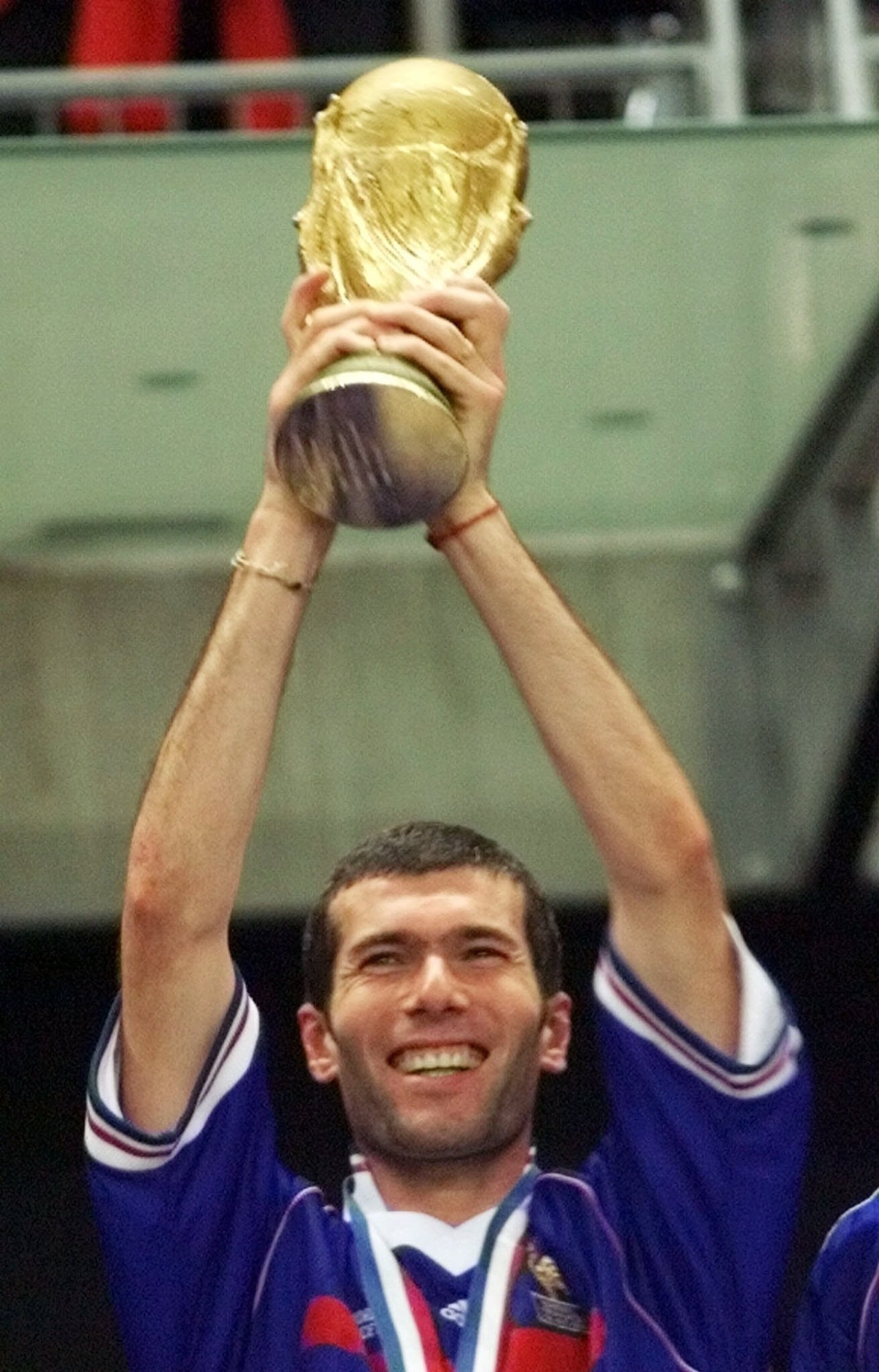Zidane holds up the World Cup trophy after France’s World Cup victory in 1998.