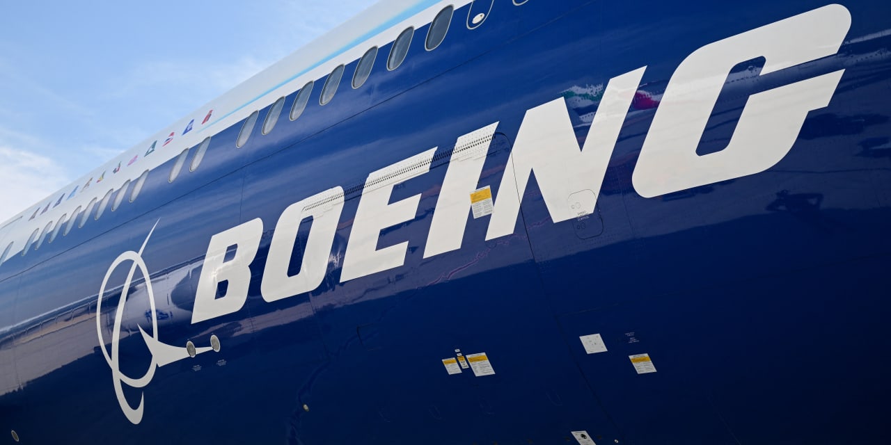 Boeing's stock rallies as surprisingly large loss is offset by upbeat revenue and backlog