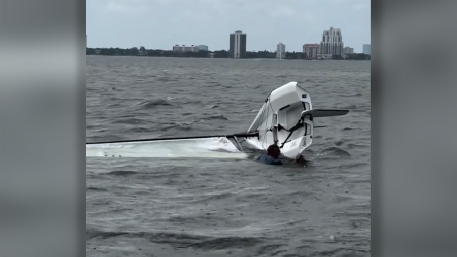 Video: Bystanders rescue stranded sailor after boat capsizes near Davis Islands
