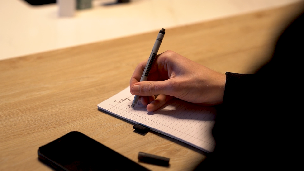 Writing down key information in a notebook for effective learning