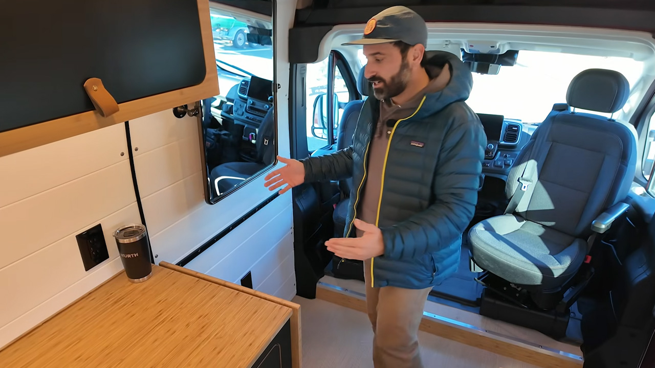 Innovative camper van custom built as both workspace and home