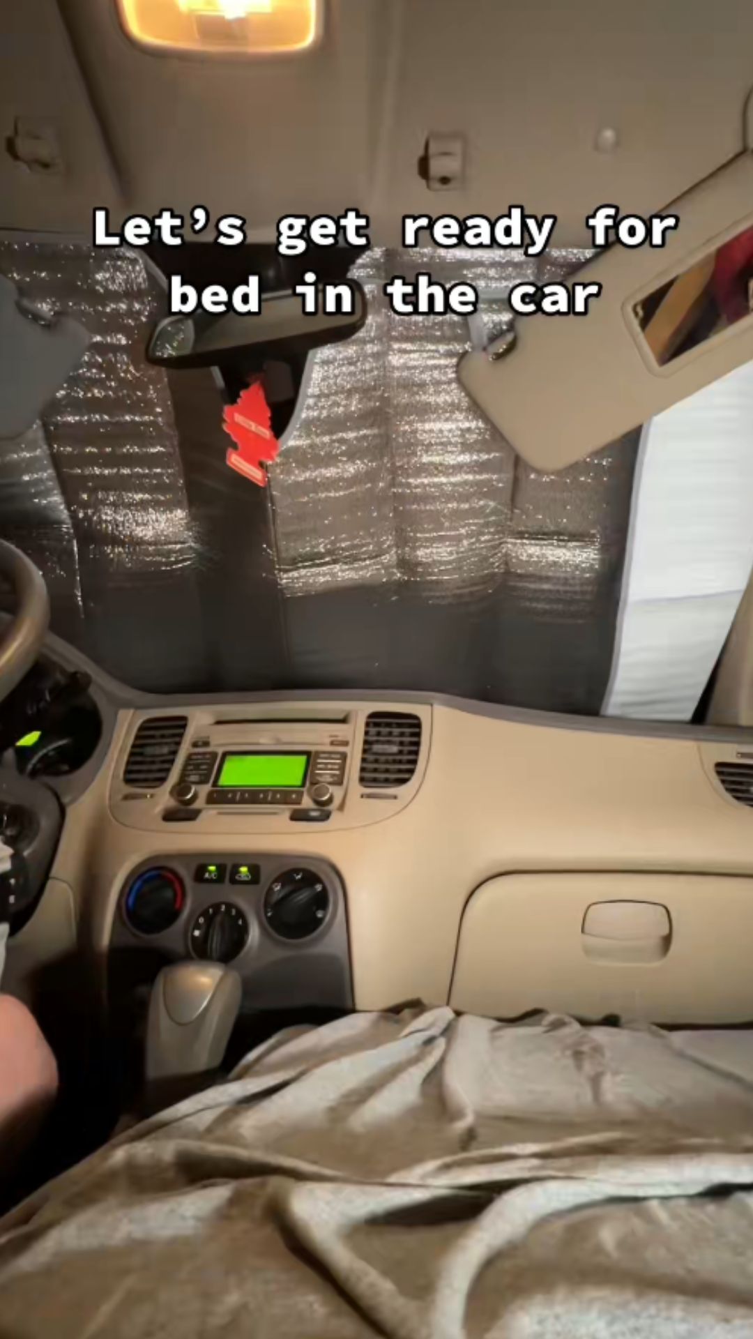 Cozy night routine inside a car camper setup