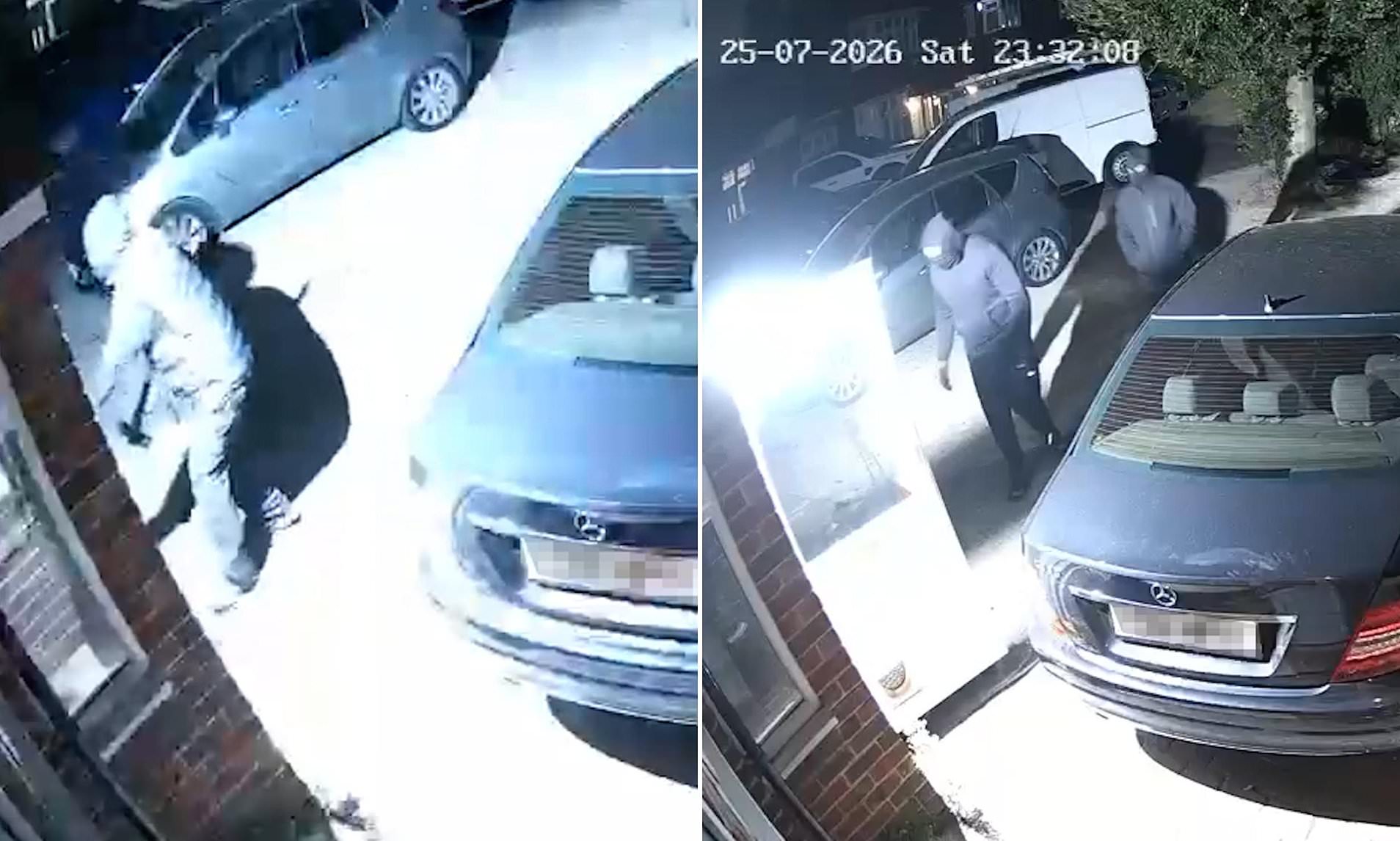 Moment family screams as five masked robbers smash their way into home during nighttime raid