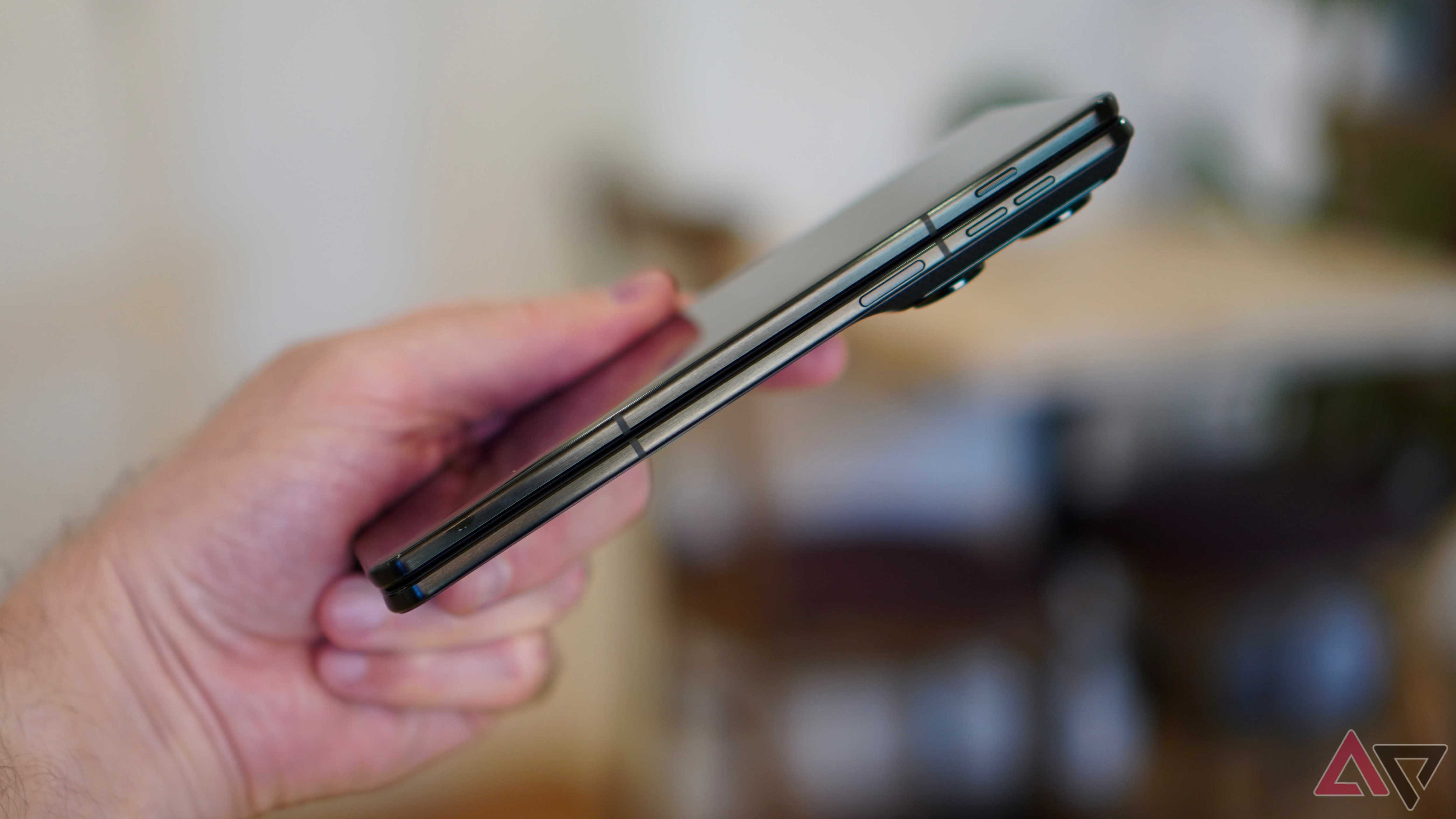 A person holding the closed Motorola Razr Fold