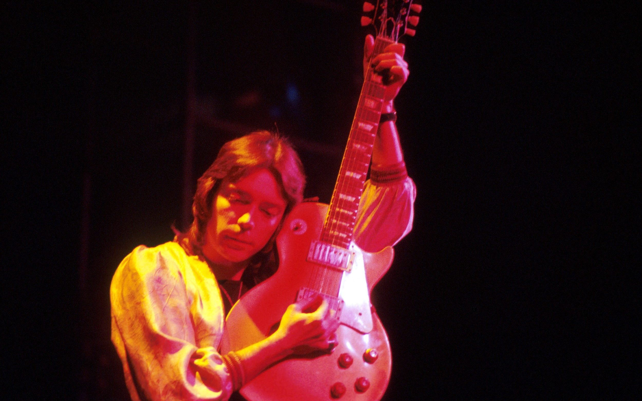 Guitarist Steve Hackett of Genesis performing on stage circa 1976.