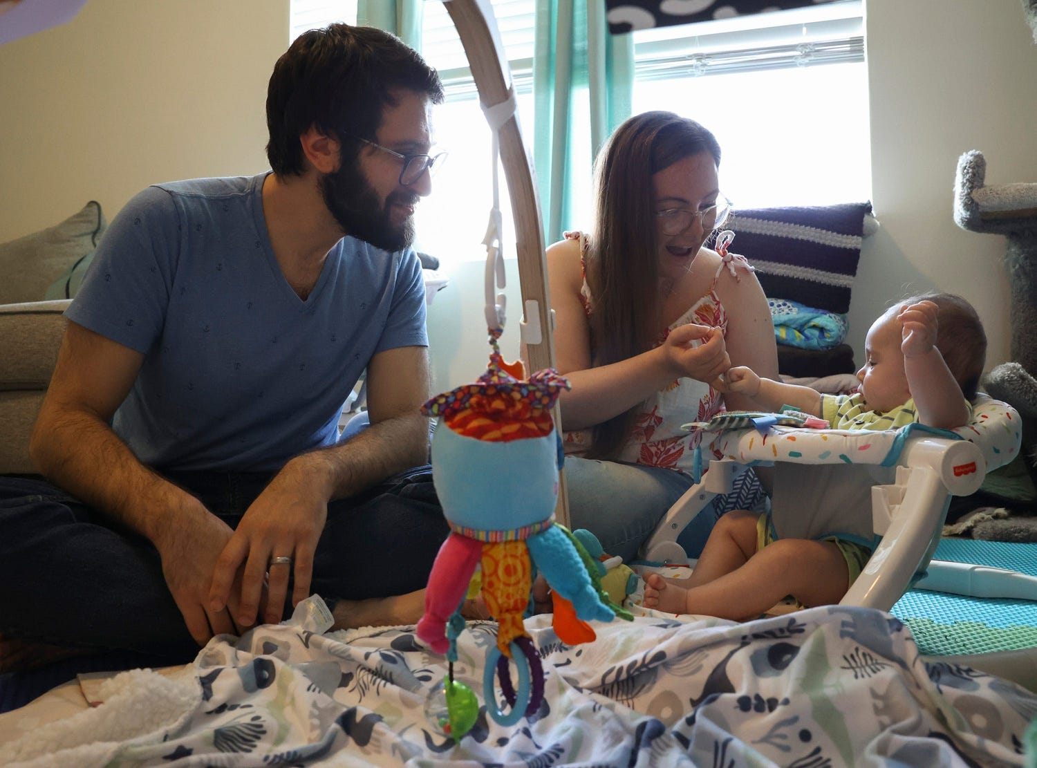 Michael, 34, and Laura Kleiman, 29, spend time in their new home taking care of their 4-month-old baby, Saturday, Aug. 19, 2023, in Port St. Lucie. The couple moved into the newly built home in December 2022 from Margate. 