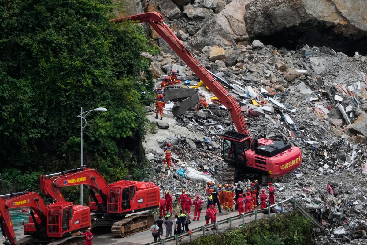 Rescuers in China race to find survivors after landslide kills 8