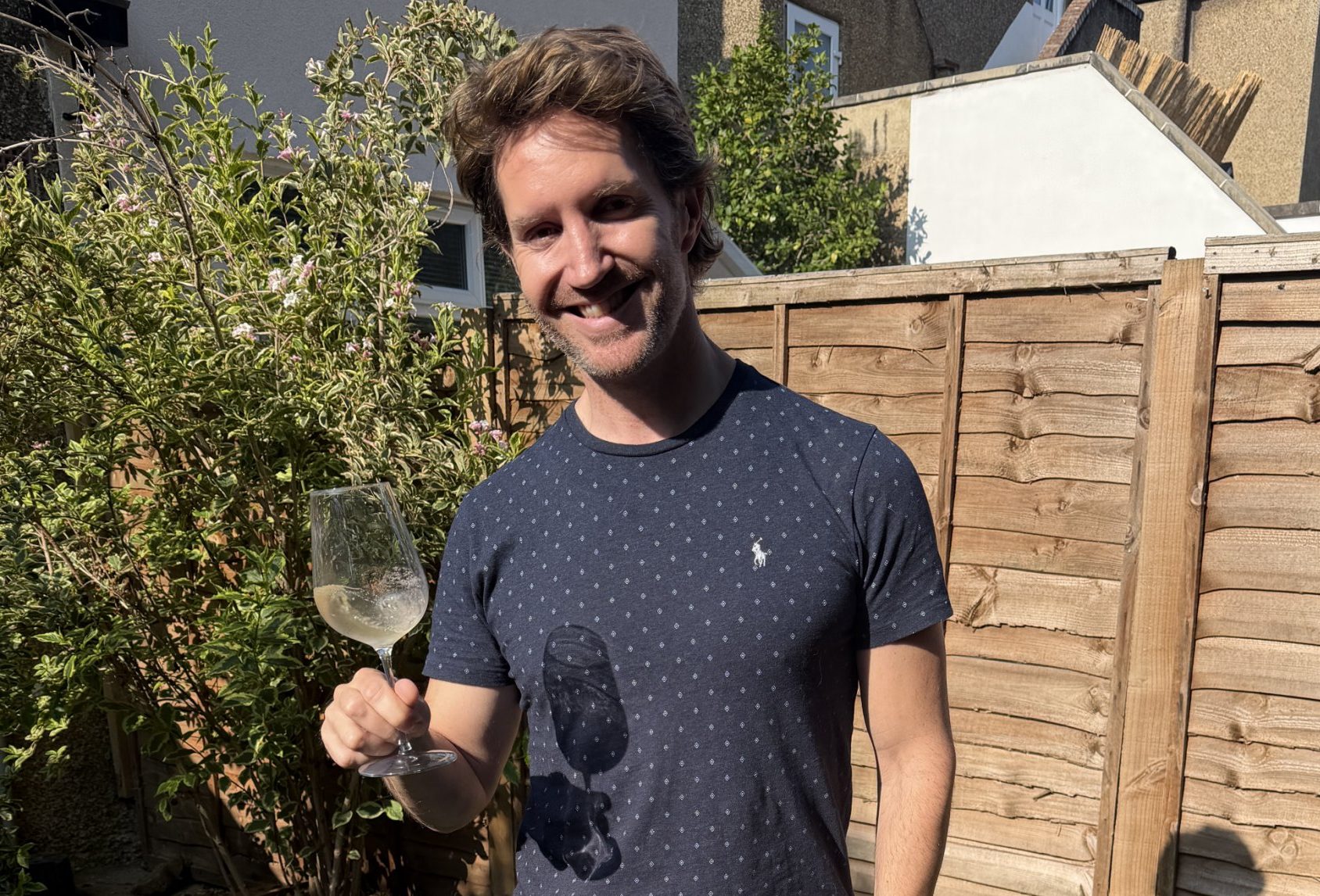 Robertson Buckhaven holding a glass of wine