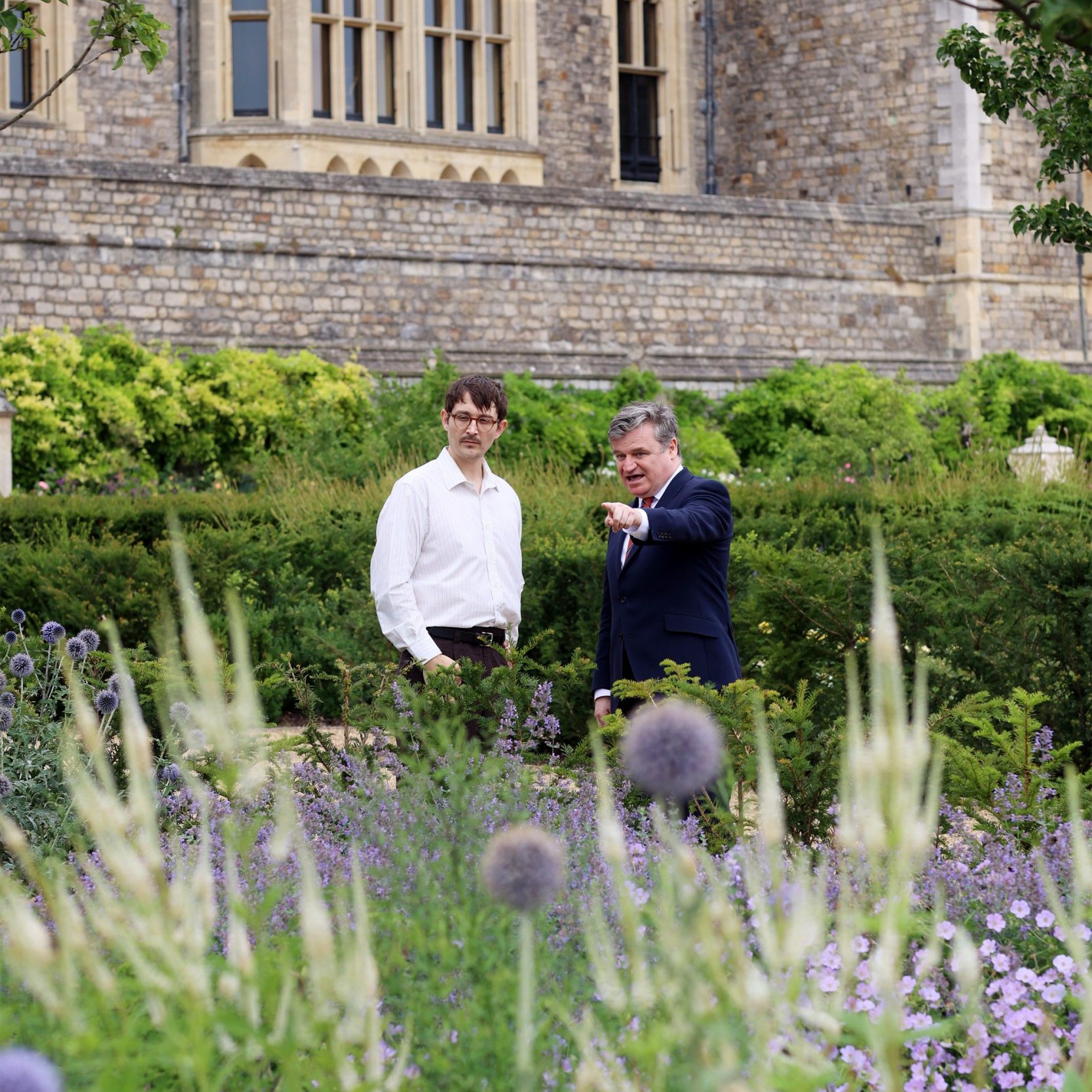 Thomas Rutter (left) is seen talking to Dr Richard Williams, Learning Curator at Royal Collection Trust