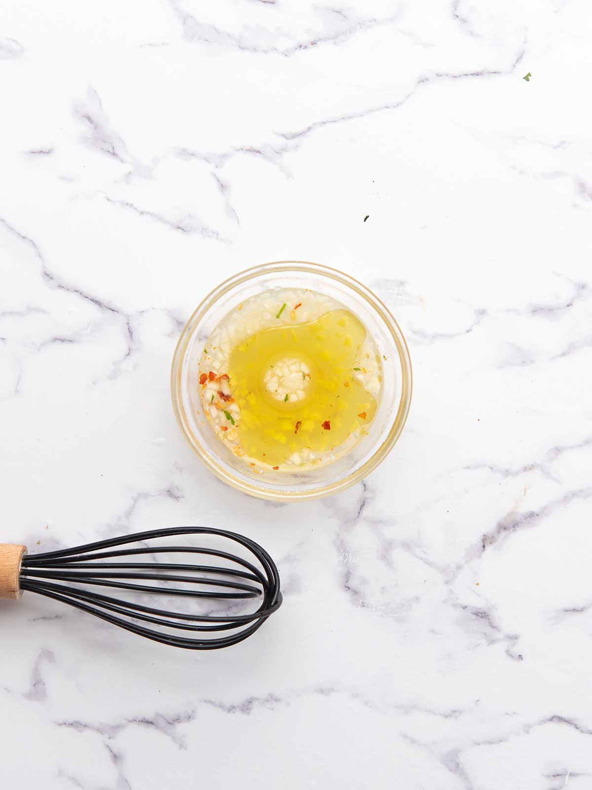 fresh lime vinaigrette is made with a whisk.