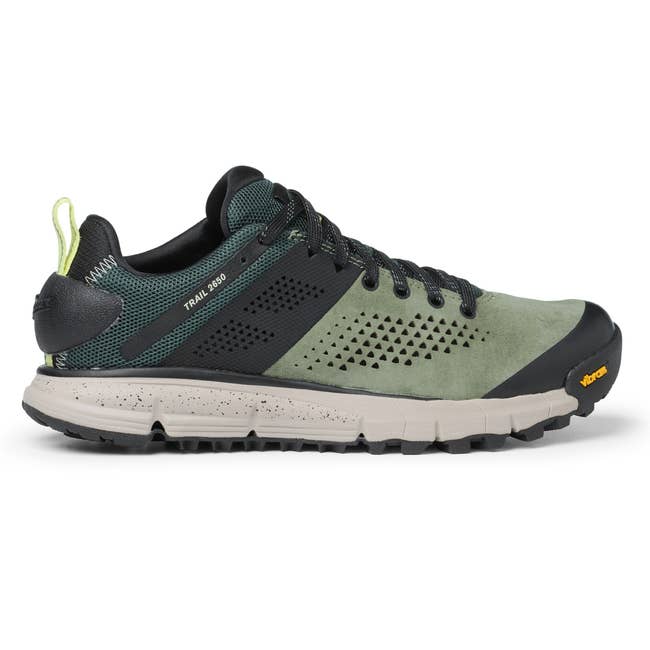 Trail running shoe with perforated design, durable sole, and supportive lacing. Suitable for outdoor and rugged terrain adventures