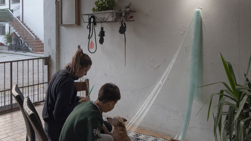 Angela Franceschetti, 28, repairs a fishing net. She never believed clams could be her only source of income and learned to fish and farm other shellfish as well. - Chiara Negrello