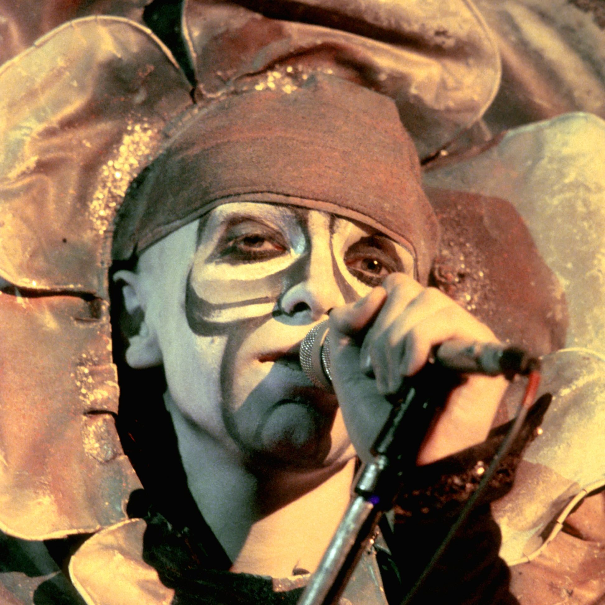 Singer Peter Gabriel of the prog rock band Genesis performs onstage his outrageous flower costume in circa 1973.