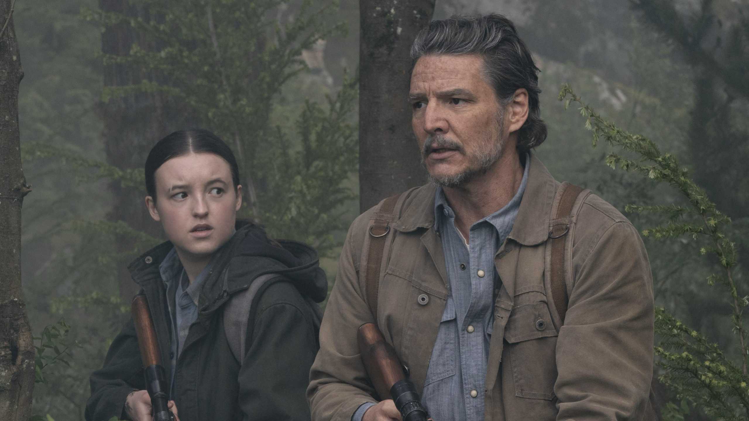 Bella Ramsey’s Ellie and Pedro Pascal’s Joel looking prepared with their guns in The Last of Us