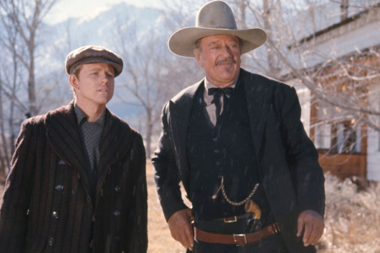 John Wayne and Ron Howard in scene in 'The Shootist' 197