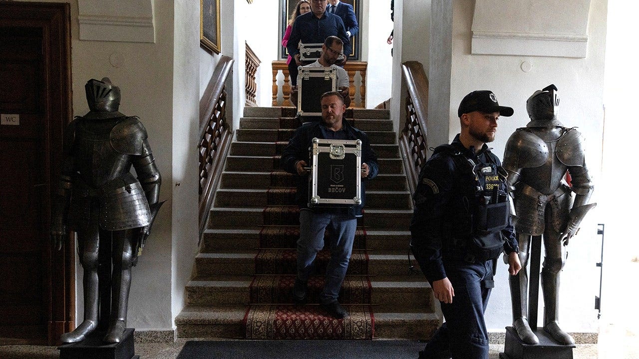 Officials carrying wine at Czech castle