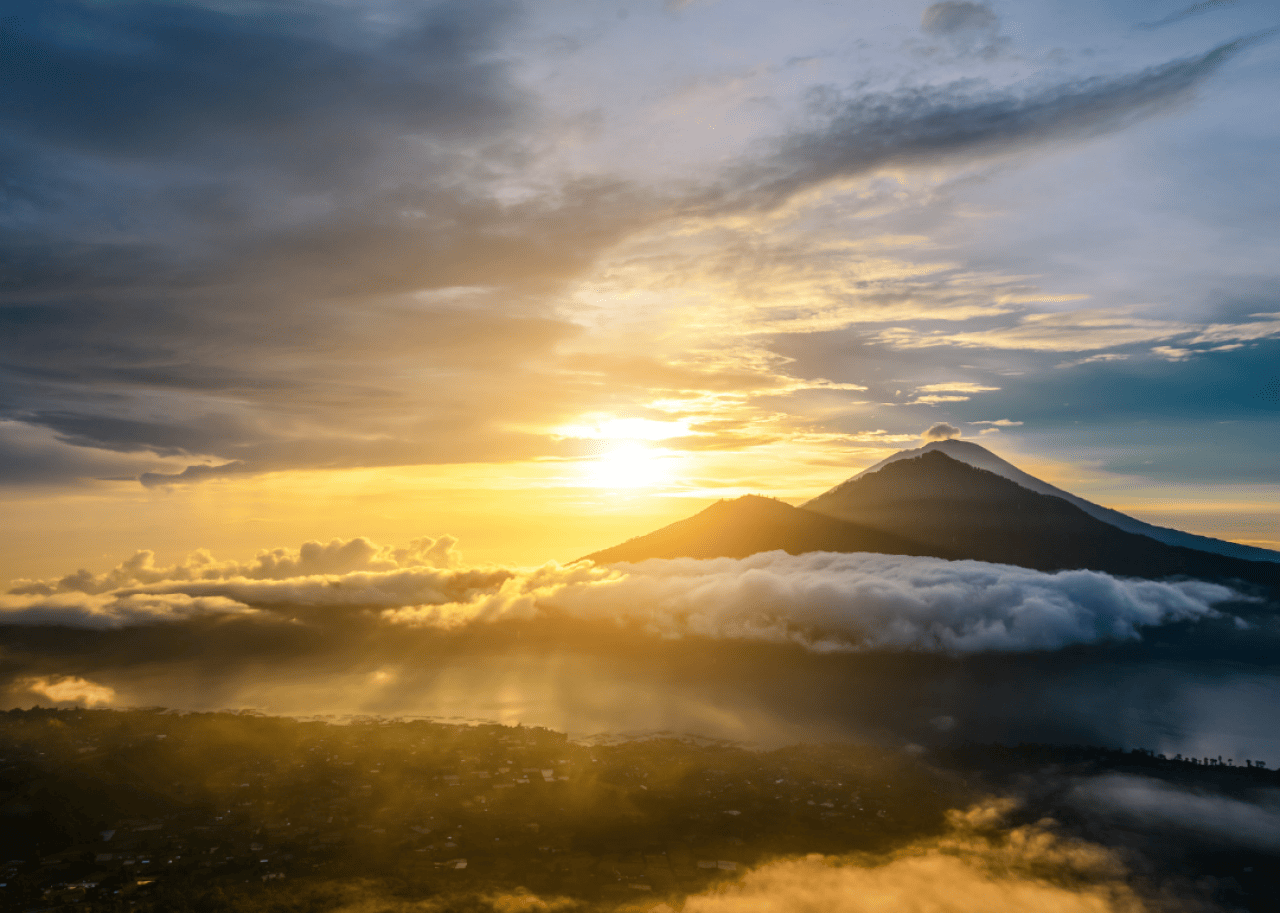 The sun setting over mountains.