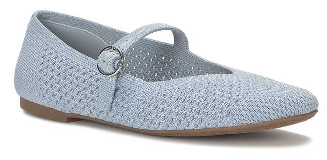 Lightweight textured flat shoe with a round buckle strap, suitable for casual and everyday wear