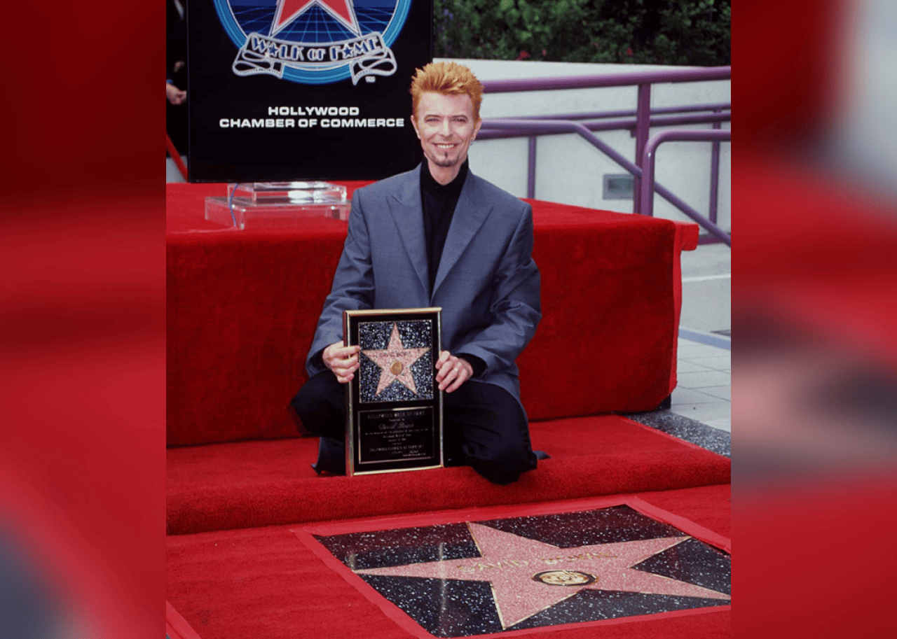 Bowie crouched down beside his star on the Hollywood Walk of Fame.