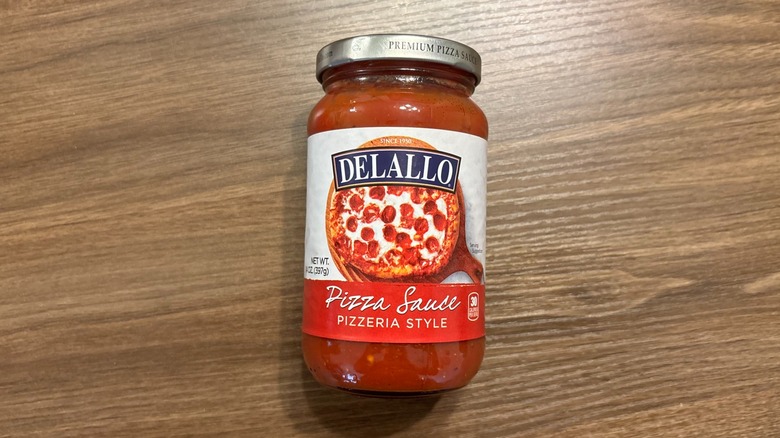 DeLallo Italian Pizzeria-Style Pizza Sauce jar on wooden table
