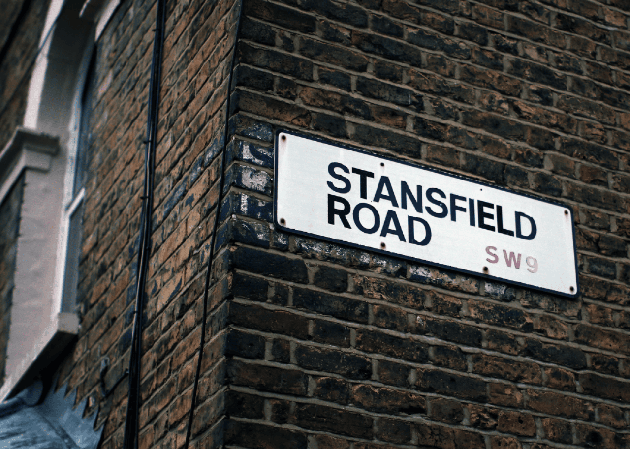 Stansfield Road sign on side of brick wall.