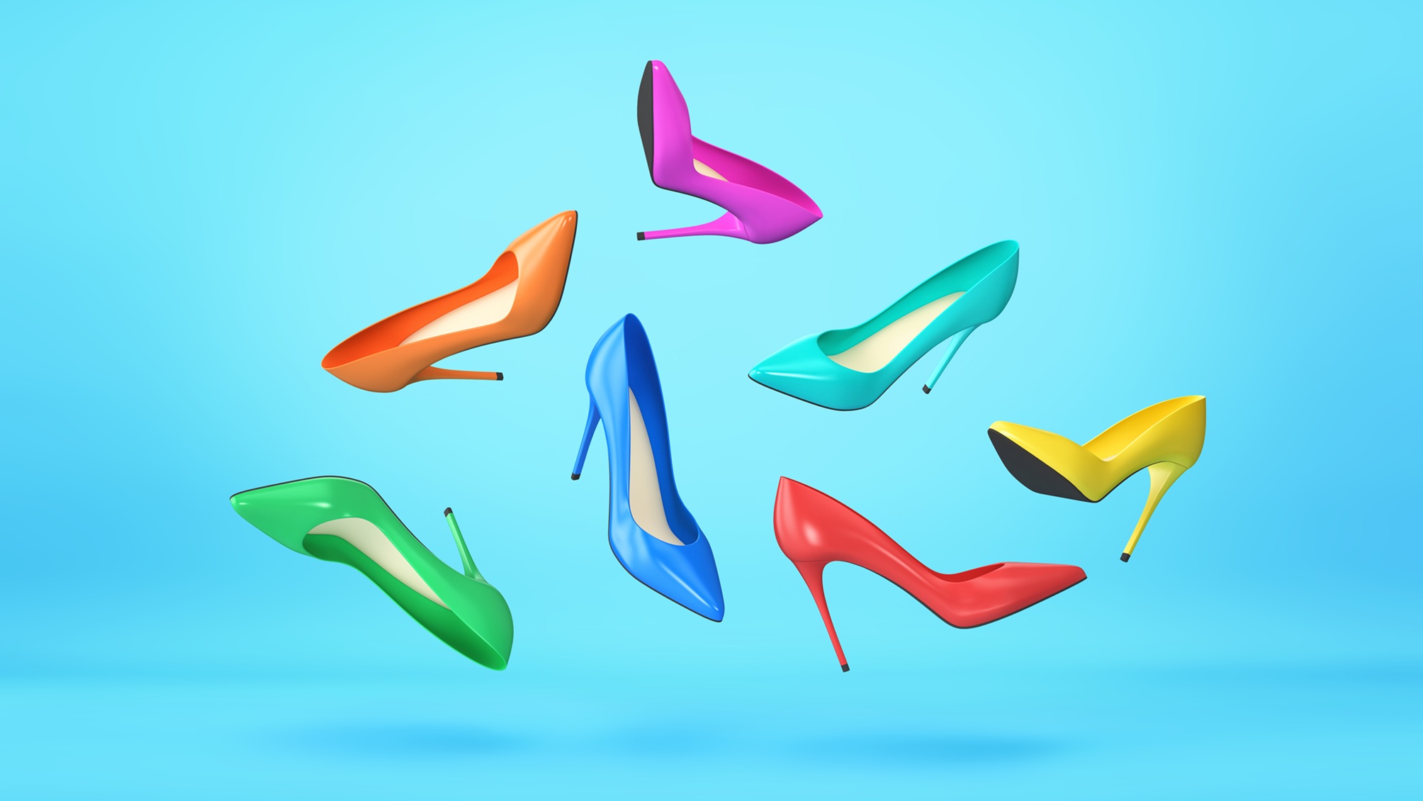 Several colorful high-heeled shoes that seem to be floating in air.