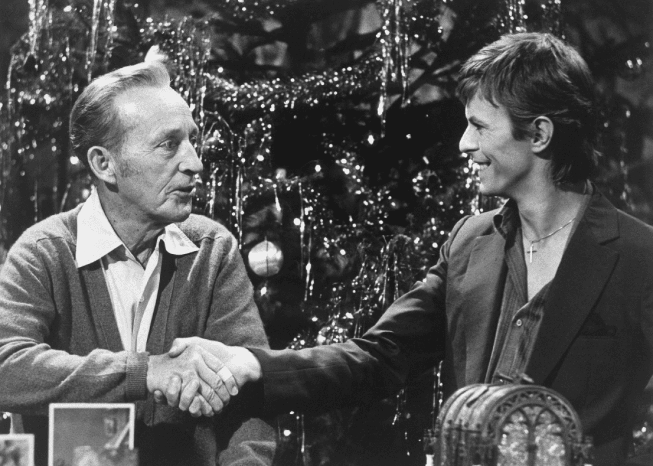 Bing Crosby and Bowie shake hands during their Christmas TV special.